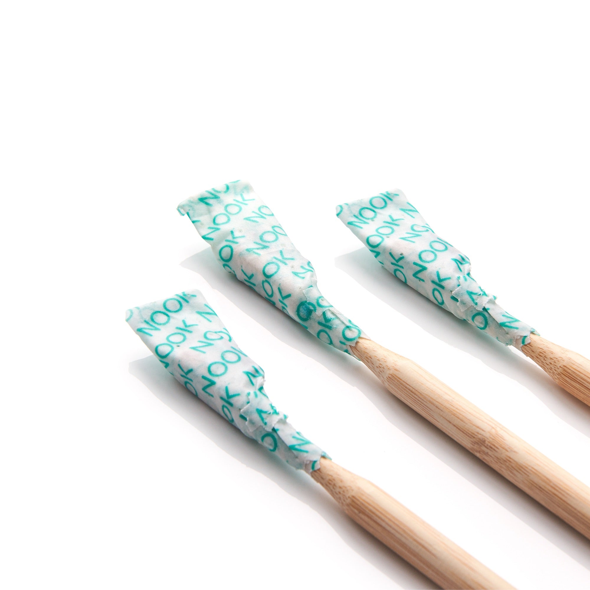 NOOK Wipes & Wrap covering bamboo toothbrush bristles